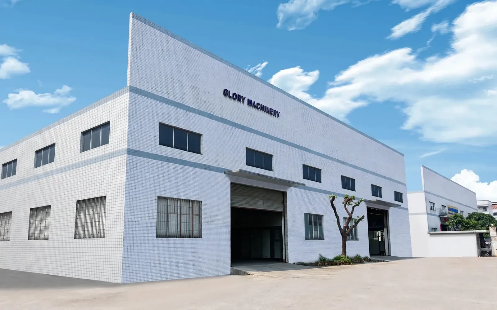 GLORY POLISHING MACHINERY factory facade in Foshan with the company logo
